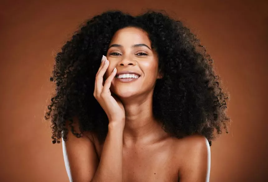 Black woman, hair and portrait with natural beauty smile for healthy cosmetic satisfaction. Beautif