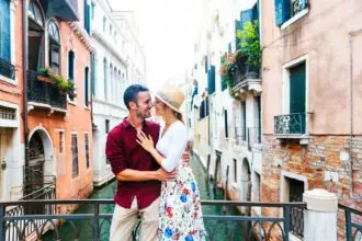 Romantic couple in love kissing in Venice, Italy