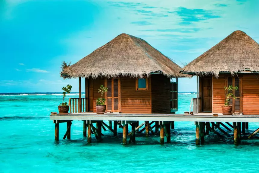 Maldives tropical Island, beautiful isolated luxury water bungalows Maldives in the blue green ocean