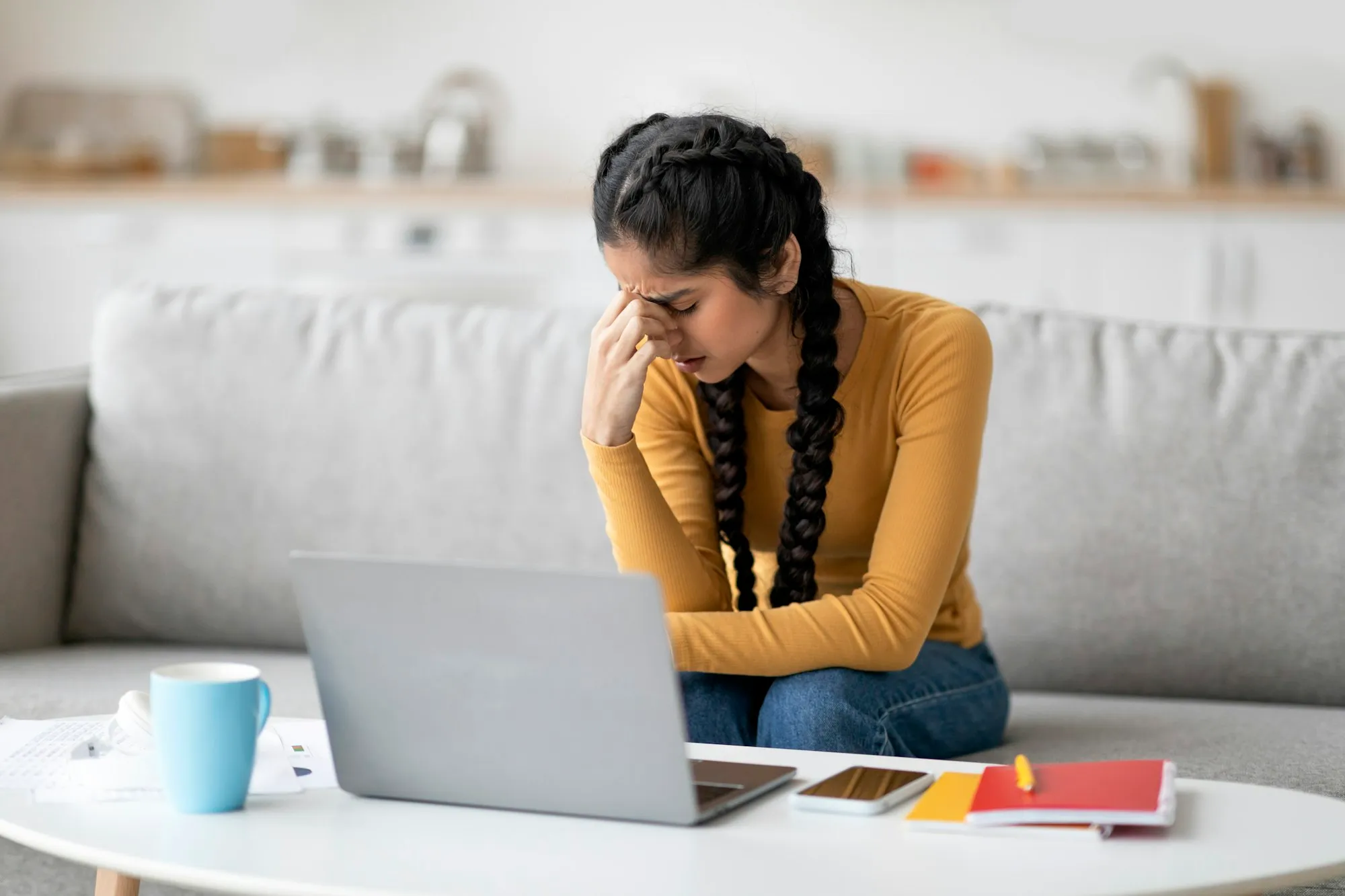 Stressed Young Indian Female Feeling Tired While Study With Laptop At Home