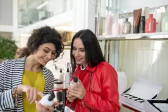 Two beaming ladies choosing hair care products