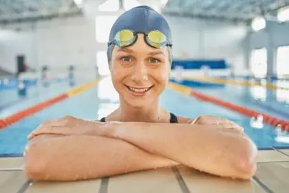 Woman, water, and portrait in swimming pool for competition, training or professional sports or exe