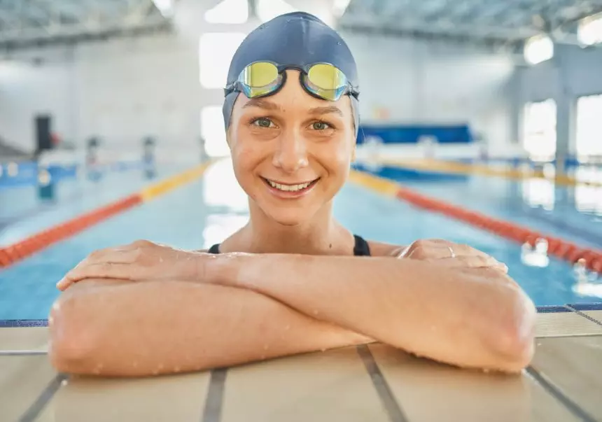 Woman, water, and portrait in swimming pool for competition, training or professional sports or exe