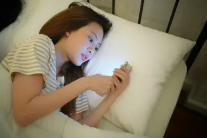 Young Woman Goes to Sleep Phone Addiction Insomnia