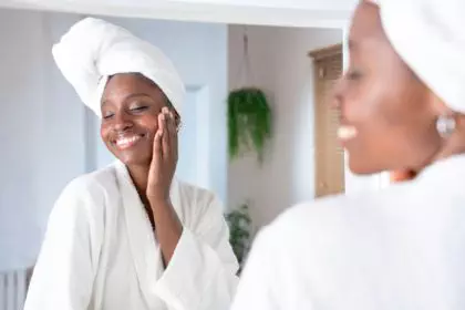 Skincare, face and cosmetic cream of a woman using facial beauty products morning self care.