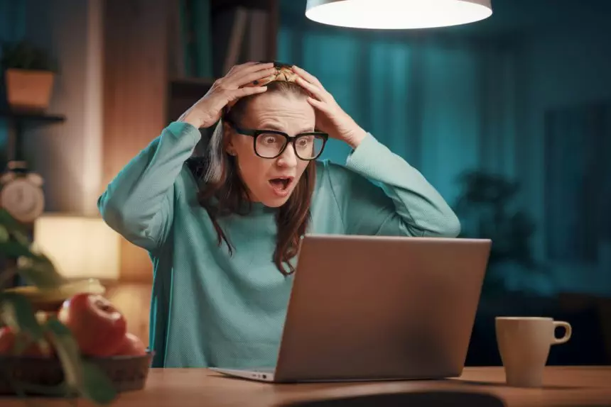 Stressed woman having problems with her laptop