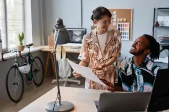 Man and woman sharing ideas on creative design