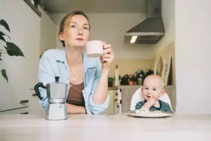 Working mother with little baby. Work-life or work-family balance
