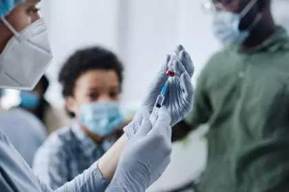 Nurse doing vaccination for children