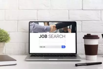 Pc on the desk with job search engine on display