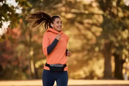 Motivated female athlete jogging in the park.