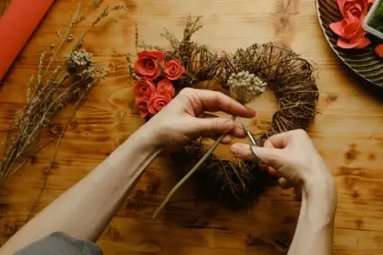 Woman makes Valentines day home decoration.