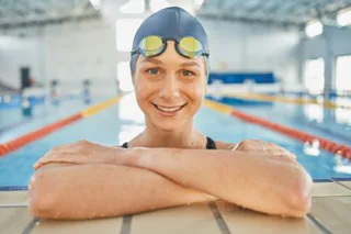 Woman, water, and portrait in swimming pool for competition, training or professional sports or exe